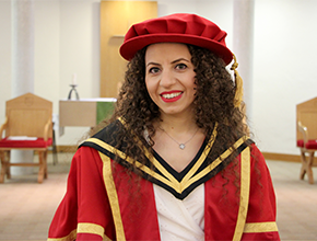 Graduate wearing red robes